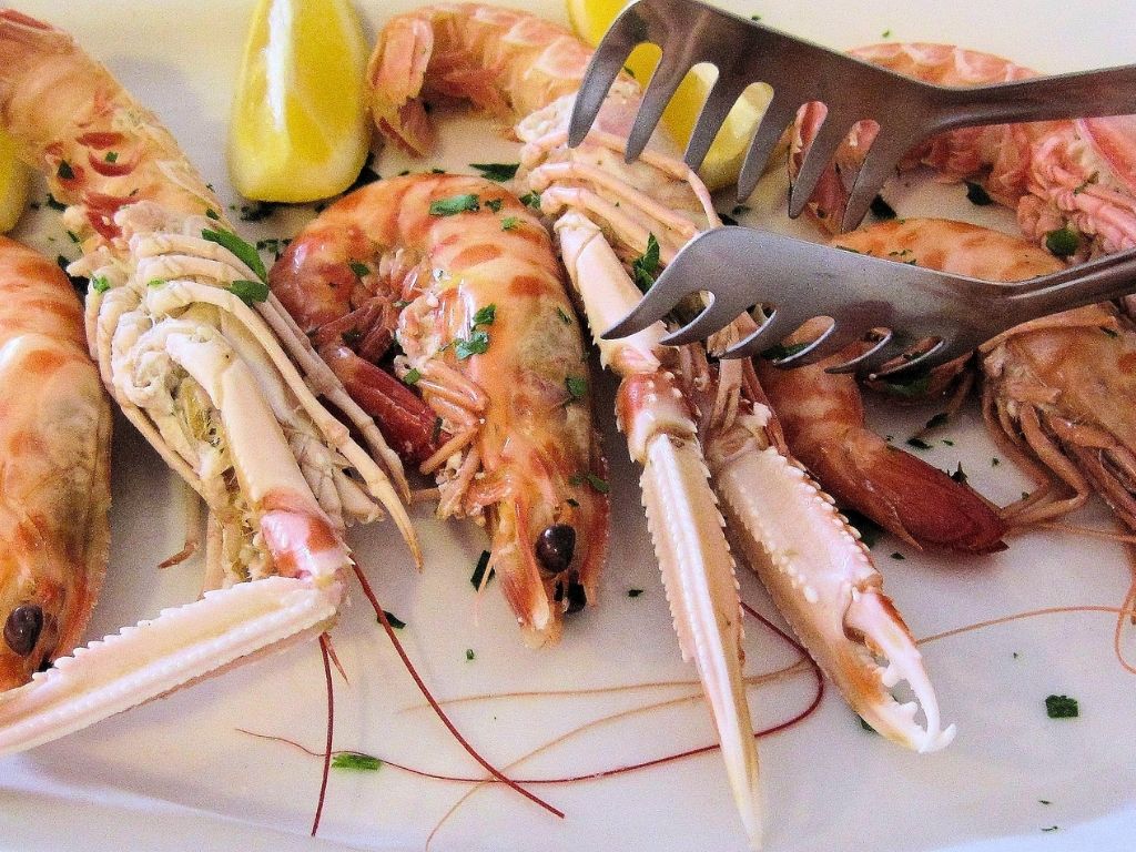 Langoustines with lemon and herbs paired with Sicilian white wine
