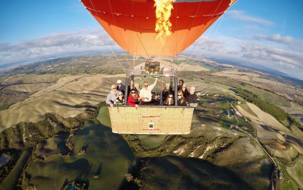 Sandy and Phil Ferretti leading a group on a hot air balloon flight over the Tuscan countryside.