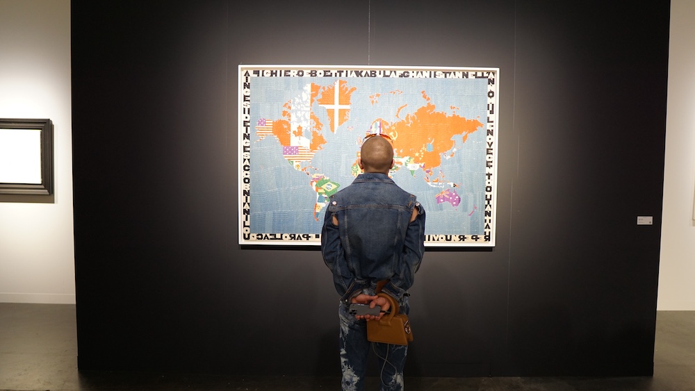 Alighiero Boetti's embroidered world map Mappa displayed by Tornabuoni Art at Art Basel Miami Beach 2025, photographed by Lisa Morales.