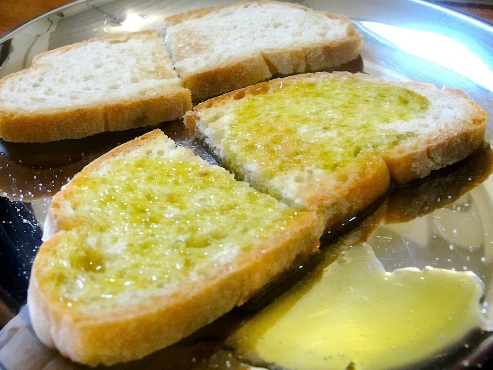 Rustic Italian bread drizzled with extra virgin olive oil.