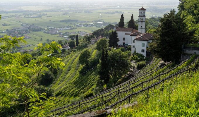 Collio wine region vineyards and historic hillside church near Cormons, Italy