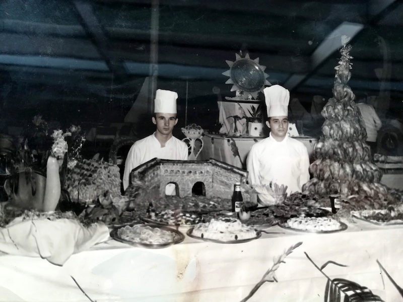 Historic photograph of chefs preparing an elaborate banquet